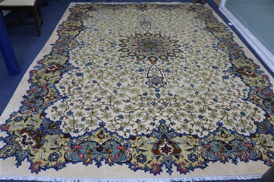 A Persian ivory ground carpet 390 x 290cm